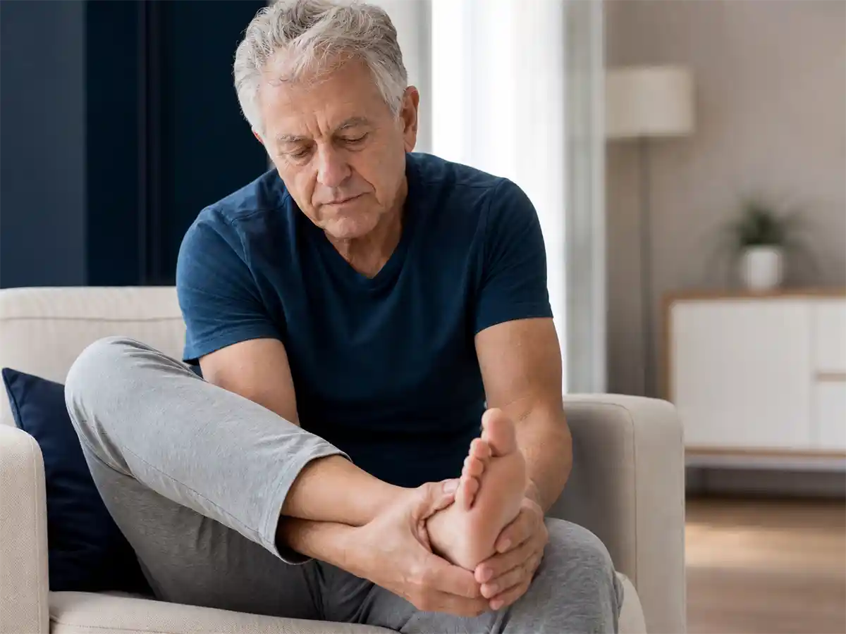 Older adult patient with peripheral neuropathy symptoms in the feet