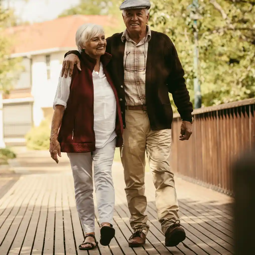 Active older couple walking comfortably outdoors