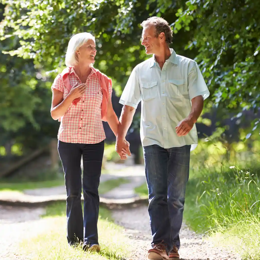 Active older couple walking comfortably outdoors
